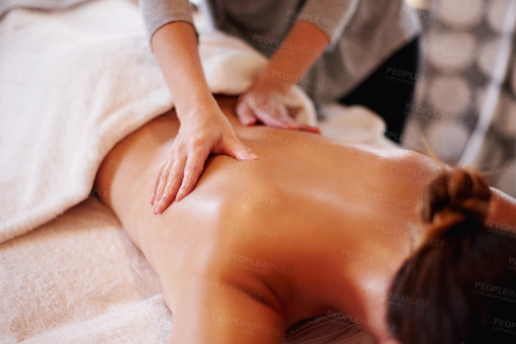 Buy stock photo Massage, back and masseuse for therapy at spa, body treatment and holistic healing with skincare. Woman, luxury resort and client pressure for beauty at salon, cosmetic service and smooth hands