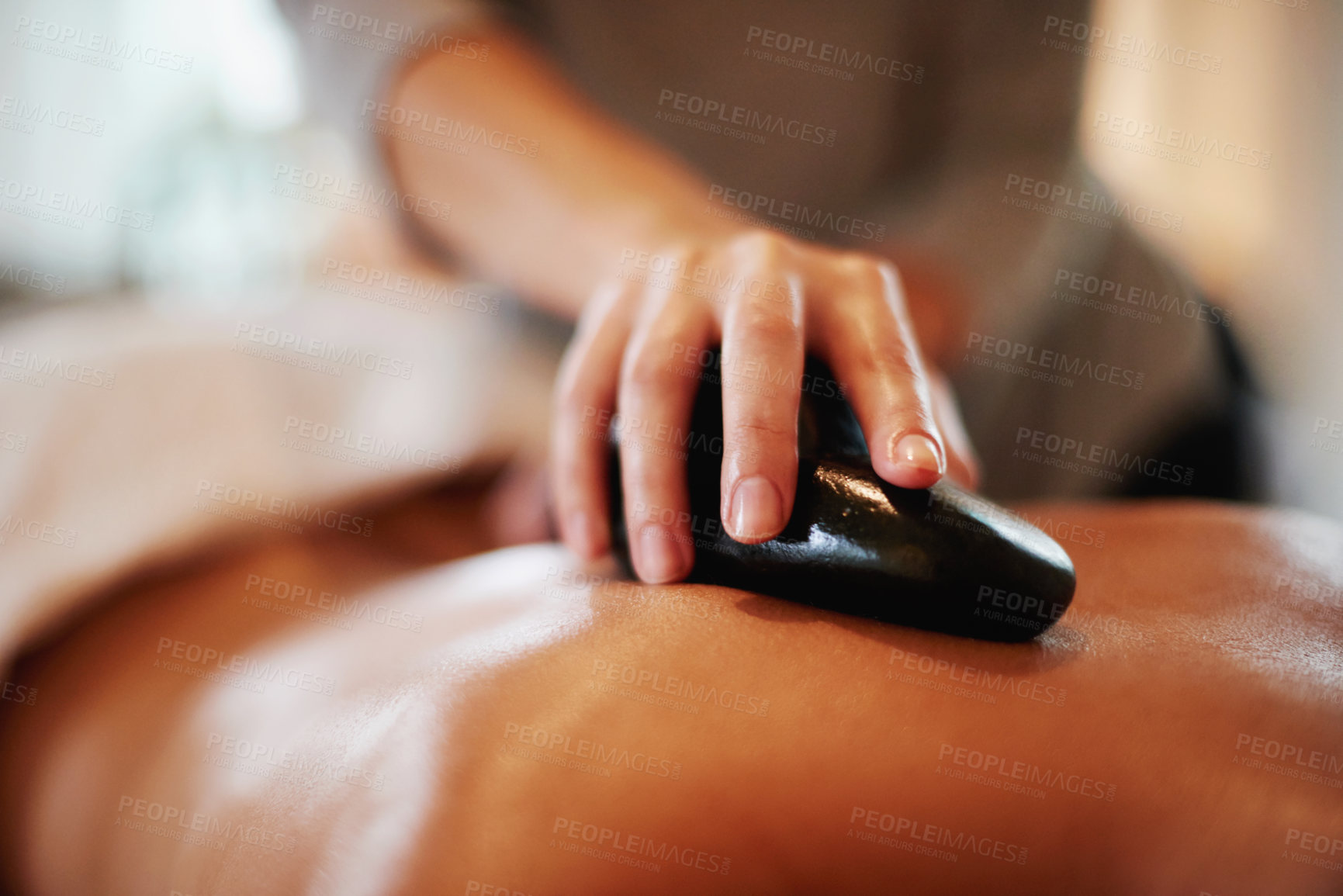 Buy stock photo Woman, hands or closeup with hot rock for massage at spa for physical therapy muscle relief or body treatment at resort. Masseuse, female person or relaxation with stone circulation at luxury salon