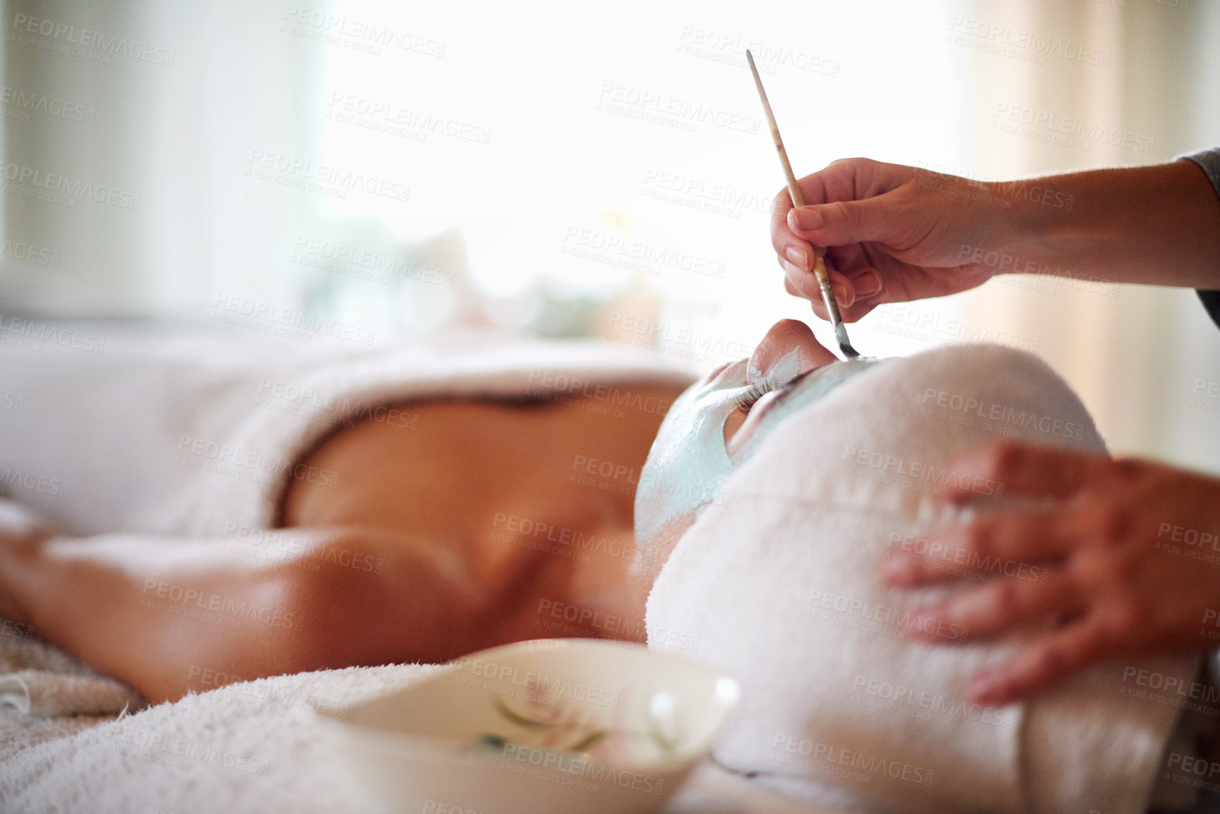 Buy stock photo Beauty, facial and woman with mask in spa for skincare treatment, wellness and healthy skin. Dermatology, luxury salon and person with beautician with clay for anti aging detox, cosmetics and cleanse
