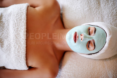Buy stock photo Relax, spa and face of woman with mask, skincare benefits or natural wellness at luxury hotel. Sleep, clay facial and calm girl on table at beauty salon for cosmetics, healthy skin or cream treatment