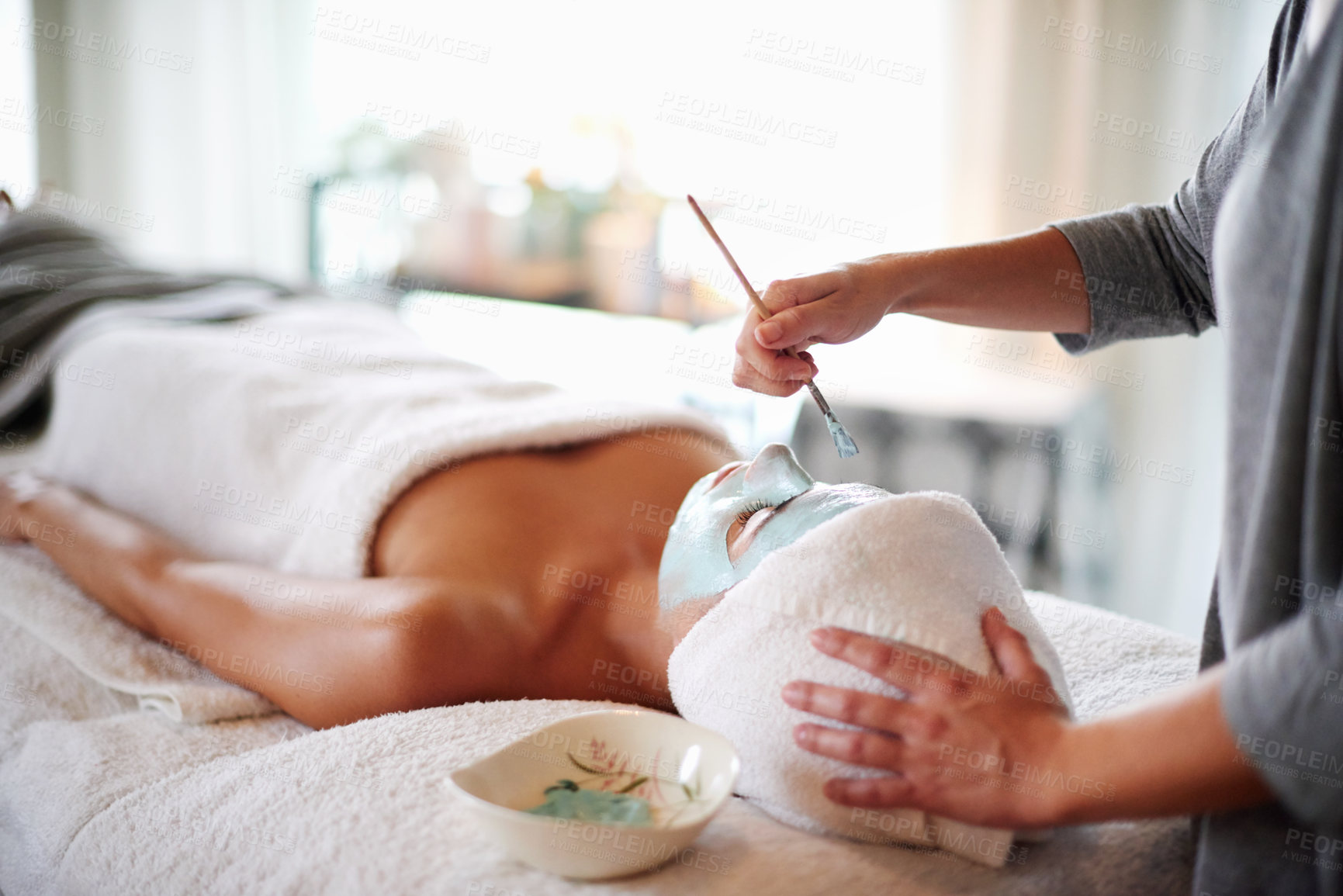 Buy stock photo Skincare, facial and woman with beautician in spa for beauty treatment, wellness and healthy skin. Dermatology, luxury salon and person with clay mask for anti aging detox, cosmetics and cleanse