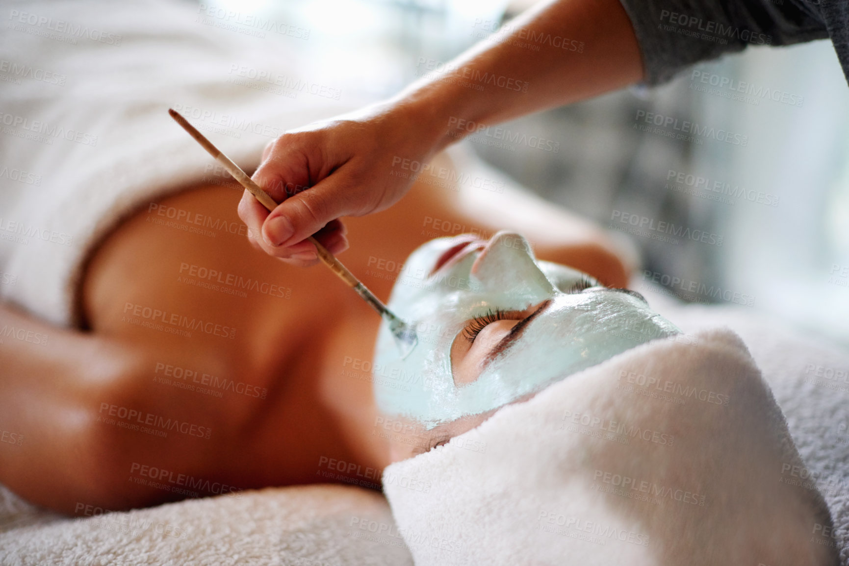 Buy stock photo Skincare, facial mask and woman with beautician in spa for beauty treatment, wellness and healthy skin. Dermatology, luxury salon and person with clay for anti aging detox, cosmetics and exfoliation