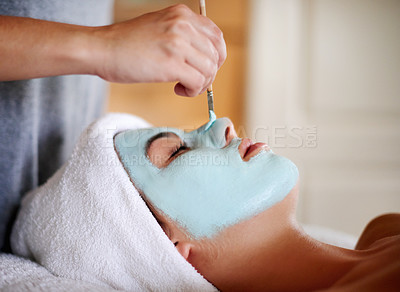 Buy stock photo Beauty, beautician and client with mask application for facial treatment, skin hydration and face rejuvenation. Spa pamper, hands or woman with clay for relaxation and natural glow at skincare salon