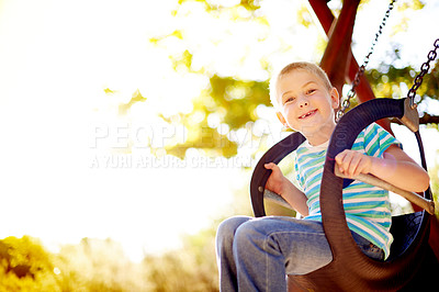 Buy stock photo Tyre, swing and portrait of kid in park with play, outdoor adventure and child development in nature. Relax, wellness and happy boy in playground for space, fun games or playful childhood on weekend