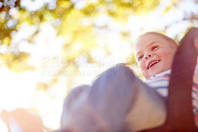 Buy stock photo Tree, swing and child in park with smile, outdoor adventure and development for kids from below. Relax, weekend and happy face of boy in playground for growth, fun games or childhood energy in nature