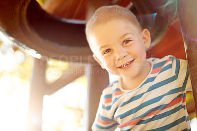 Buy stock photo Development, growth and portrait of boy at playground, having fun in nature for activity, games or play. Coordination, motor skills and smile of happy child outdoor at jungle gym in park with flare