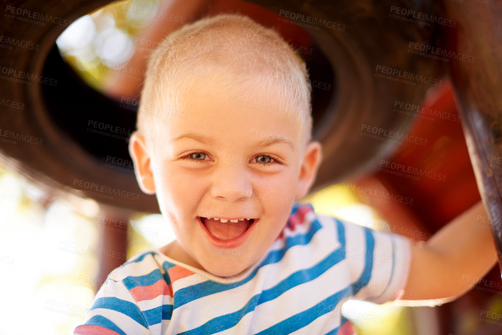 Buy stock photo Excited, growth and portrait of boy at playground, having fun in nature for activity, games or play. Coordination, motor skills and smile of happy child with energy outdoor at jungle gym in park