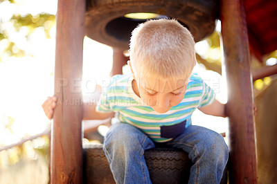 Buy stock photo Climbing, development and boy child at playground, having fun in nature for activity, games or play. Coordination, motor skills and growth with curious kid outdoor on wooden jungle gym in park