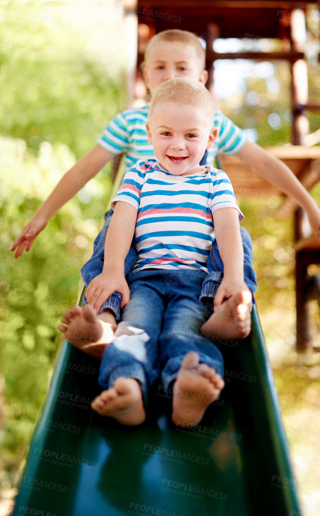 Buy stock photo Happy, playing and portrait of children on slide in park for physical skills, confidence or fun. Exploring, nature and boy kids on playground equipment for adventure, hobby or cognitive development.