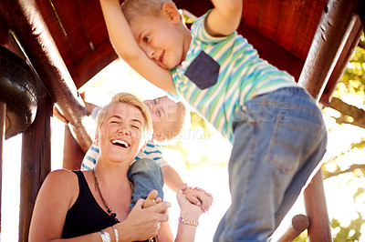 Buy stock photo Laugh, playground and mom with children in park for playing, childhood and adventure outdoors. Happy, family and mother with young boy for bonding, learning skills and development on jungle gym