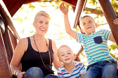Buy stock photo Happy, nature and portrait of mom with children in park for school holiday, fun or bonding. Connection, family and mother with boy kids outdoor in field laughing for joke, comic or comedy together.