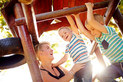 Buy stock photo Laughing, playground and mom with children in park for playing, childhood and adventure outdoors. Nature, family and mother with kids for bonding, learning skills and development on jungle gym