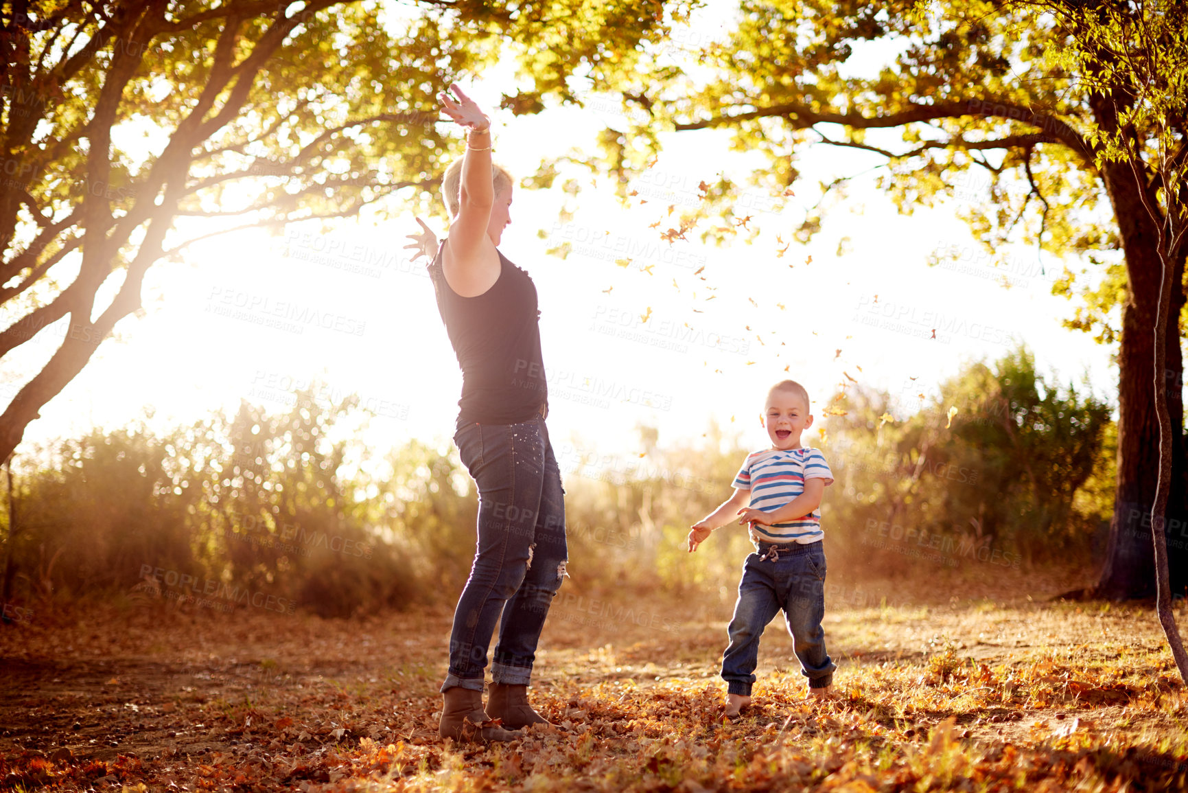 Buy stock photo Autumn, leaves and mom with child in nature for playing games, bonding and have fun together. Family, park and mother with kid excited for season change for childhood, adventure and freedom outdoors