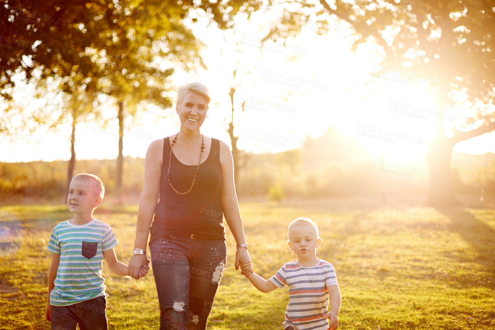 Buy stock photo Happy mom, sunshine and playground with children in nature for playful weekend, holiday or summer. Mother, kids or siblings with smile for bonding, adventure or childhood together at outdoor park