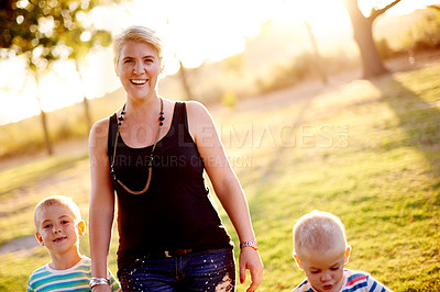 Buy stock photo Happy mother, portrait and playground with children in nature for playful weekend, holiday or summer. Mom, kids or siblings with smile for bonding, adventure or childhood together at outdoor park