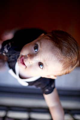 Buy stock photo Curious, development and growth with baby in home for coordination, learning or wonder from above. Balance, climbing and standing up with infant girl child in apartment or nursery for first steps
