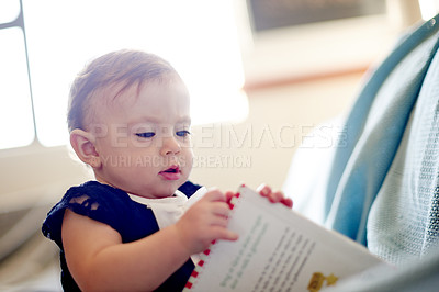 Buy stock photo Baby, girl and playing with book for story, childhood or youth in development at home. Little child, kid or adorable infant with novel for learning, curiousity or imagination in nursery at house