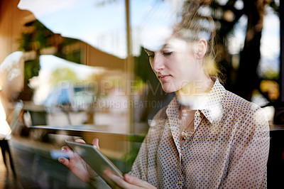 Buy stock photo Tablet, remote work and woman in coffee shop, reading email and editing news for politics. Cafe, freelancer and journalist on digital technology for online story, scroll article and report by window