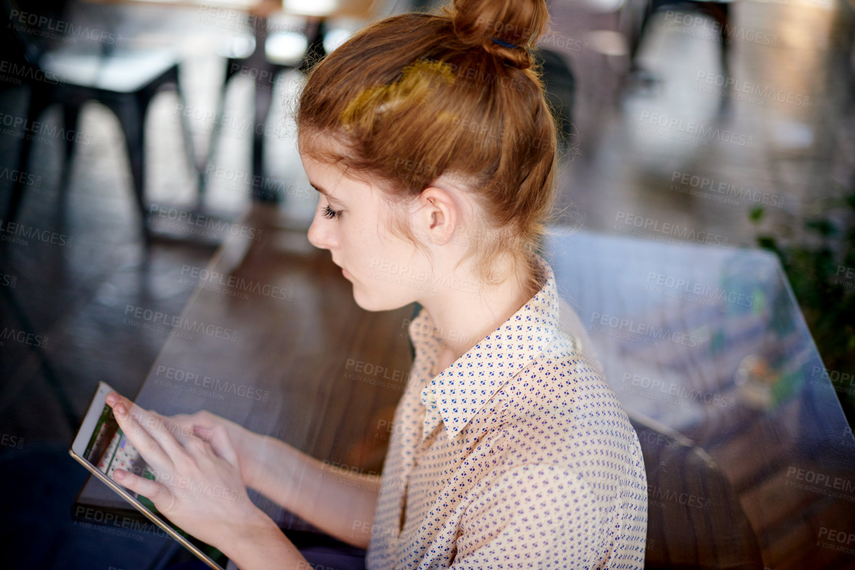 Buy stock photo Tablet, online and woman in cafe for game, card app and play while waiting for date. Coffee shop, customer and girl on digital technology for relax, entertainment and scroll on internet competition