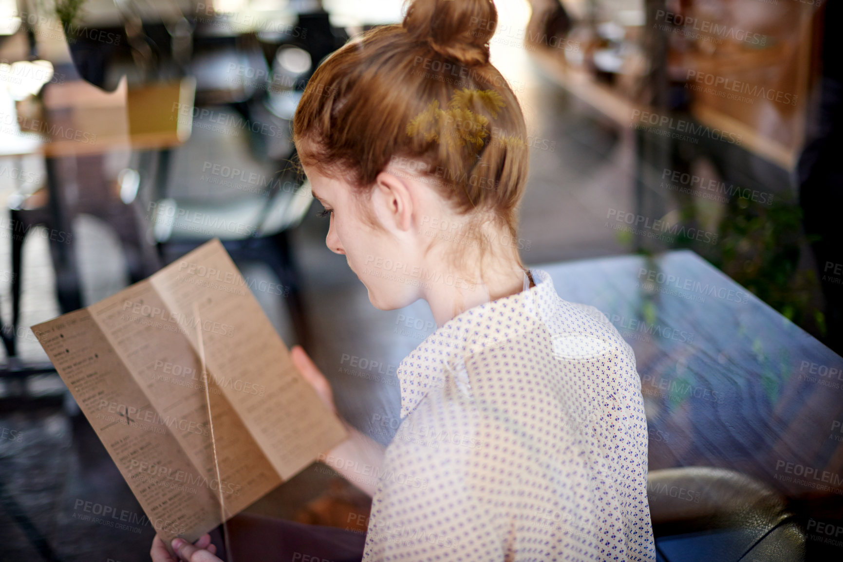 Buy stock photo Cafe, woman and reading with menu, food decision or beverage choice. Girl, back and lunch with options of restaurant for hunger, snack or meal at coffee shop or bistro for hungry customer order