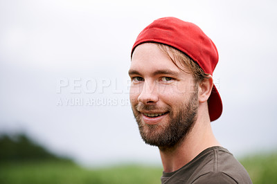 Buy stock photo Smile, portrait and man hiking in nature for travel, adventure and mockup space in countryside. Face, trekking and person with hat in forest for tourism, vacation journey and explore Switzerland