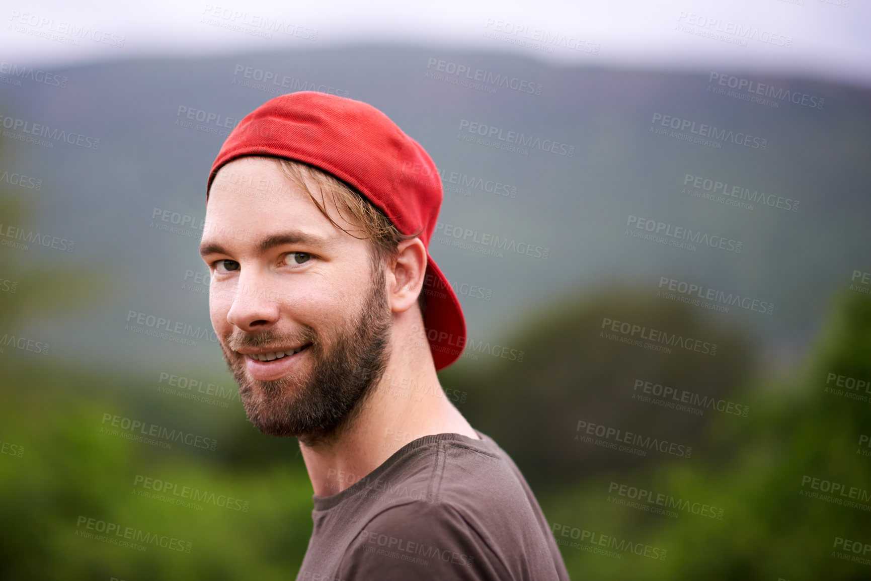 Buy stock photo Smile, portrait and man hiking in forest for travel, adventure and holiday trip in countryside. Face, trekking and person with cap in nature for tourism, vacation journey and exploration in Australia