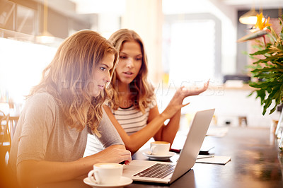 Buy stock photo Laptop, meeting and planning with sisters in coffee shop together for partnership or small business management. Computer, discussion and research with woman twin siblings in restaurant as owners