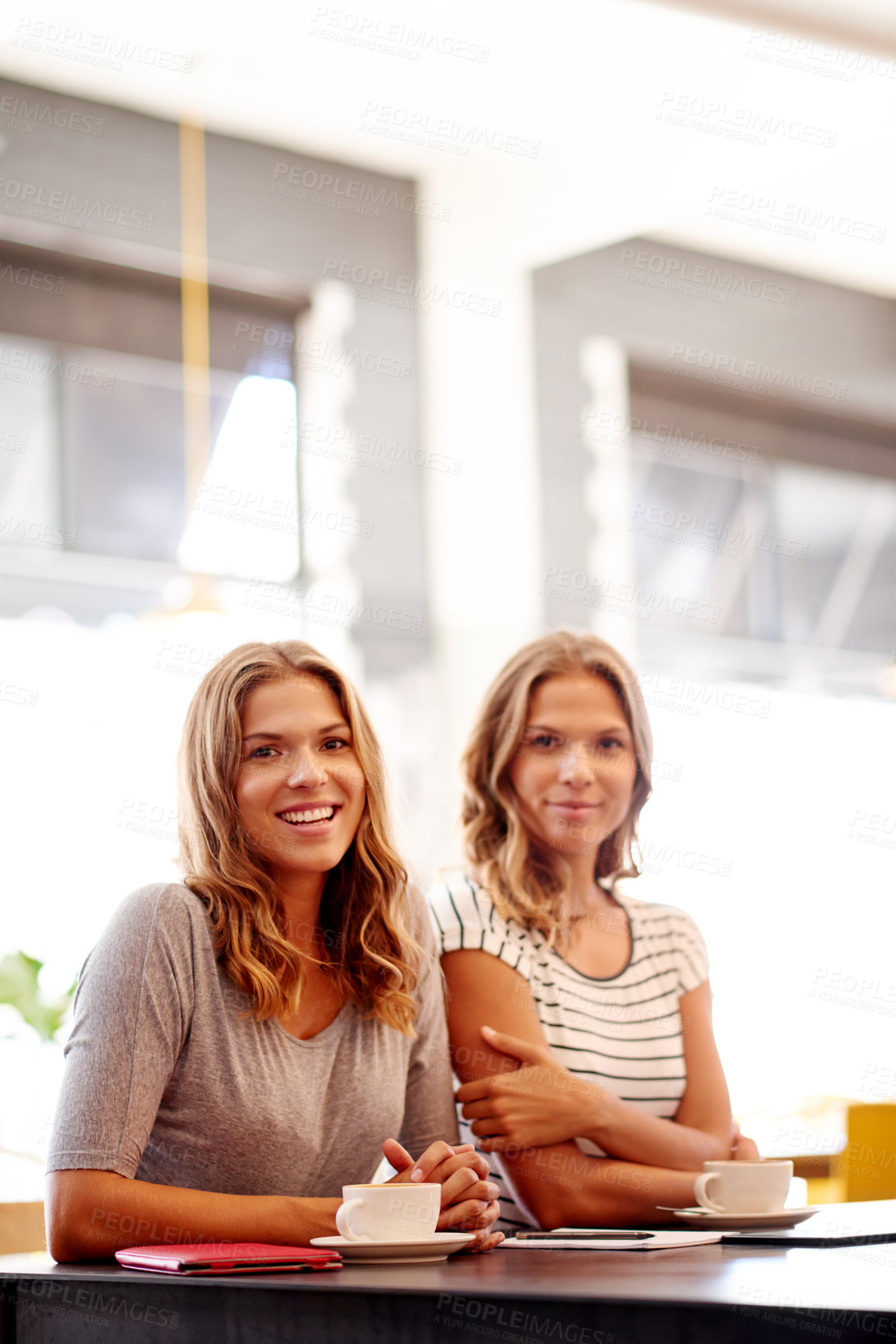 Buy stock photo Women, portrait and cappuccino in cafe for social meeting, connection and bonding at lunch date. Smile, brunch and twin sisters in coffee shop together for morning drinks, chat and restaurant reunion