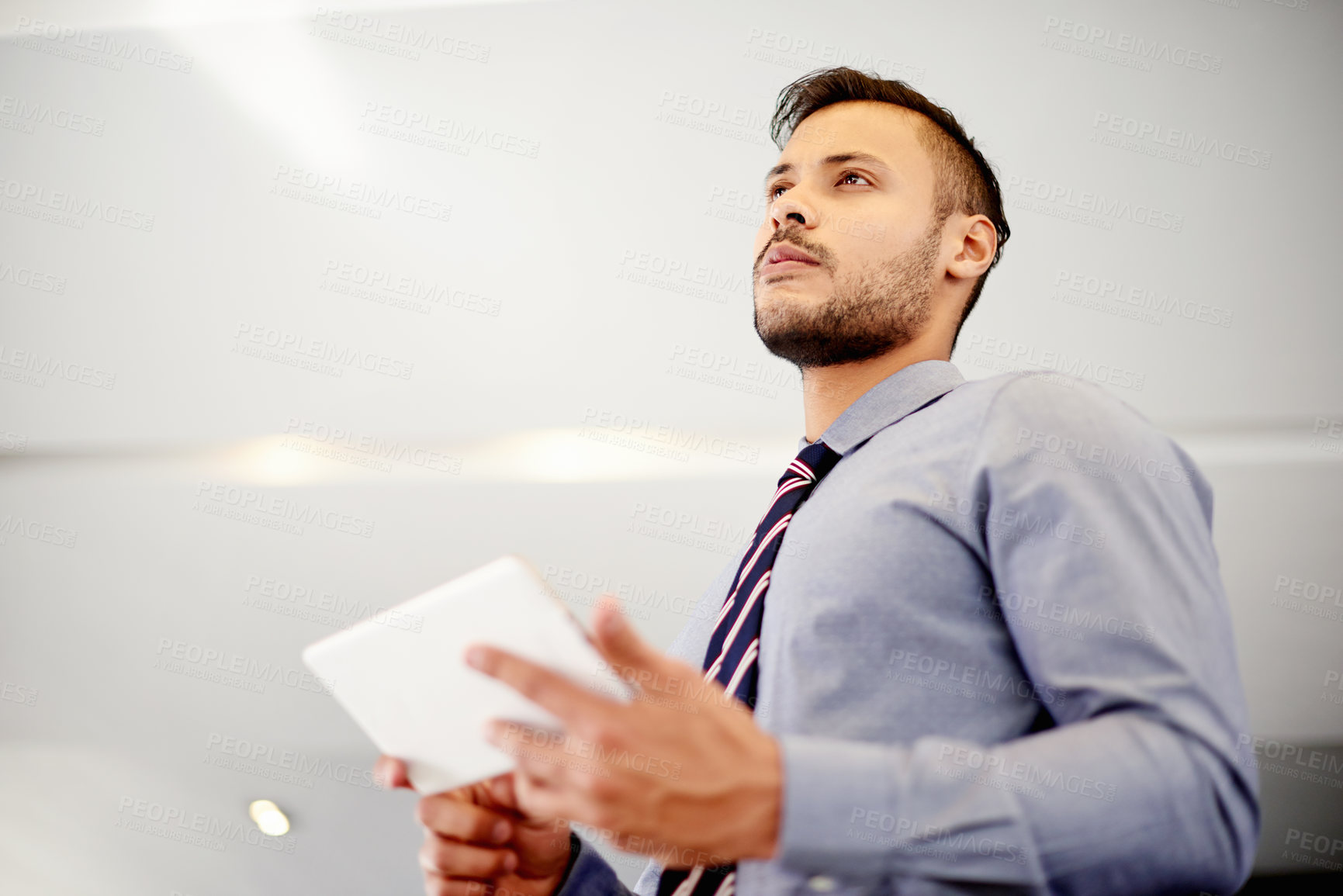 Buy stock photo Thinking, serious and man with tablet, office and planning for budget of company, accountant and online. Contemplating, auditor and person with app for financial report, corporate and investment