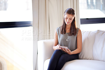 Buy stock photo Freelancer, woman or tablet on sofa in home for article research, reading client feedback or website update. Remote work, writer or digital app in lounge for online journal, blog post or proofreading