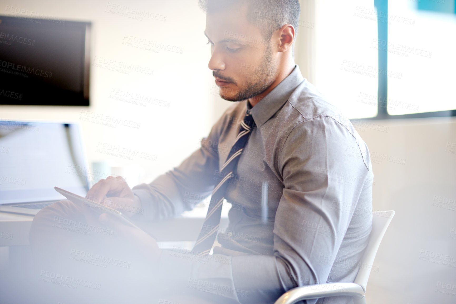 Buy stock photo Accounting, serious and man with tablet, online and planning for financial report of company or office. Corporate, website and person with app for investment, employee and notification of email