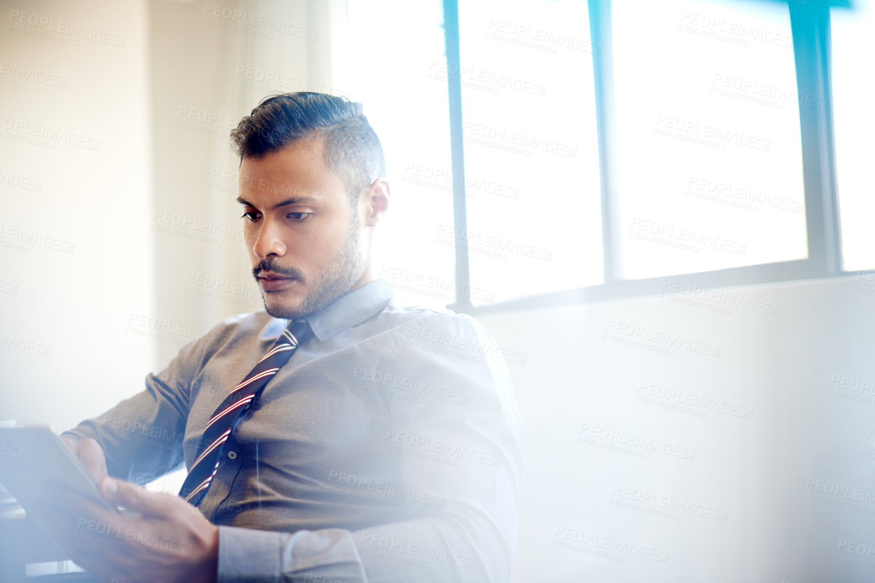 Buy stock photo Accounting, serious and man with tablet, office and planning for financial report of company or online. Corporate, website and person with app for investment, employee and notification of email
