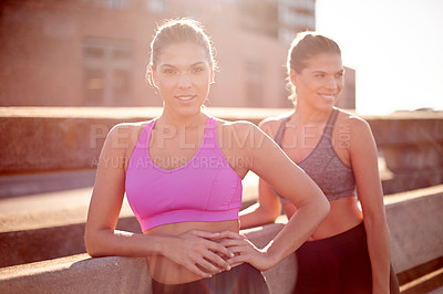 Buy stock photo Fitness, sisters and happy women in city for exercise, training and athlete on workout break. Sports, twins and outdoor together for body health, wellness and relax to rest with family or siblings