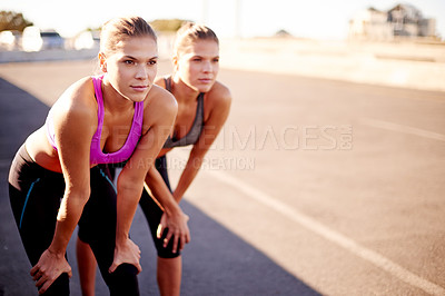 Buy stock photo Tired, friends and fitness for women, serious and training with sportswear in morning and outdoor. Bridge, athlete and people with routine for wellness, together and healthy with workout in city