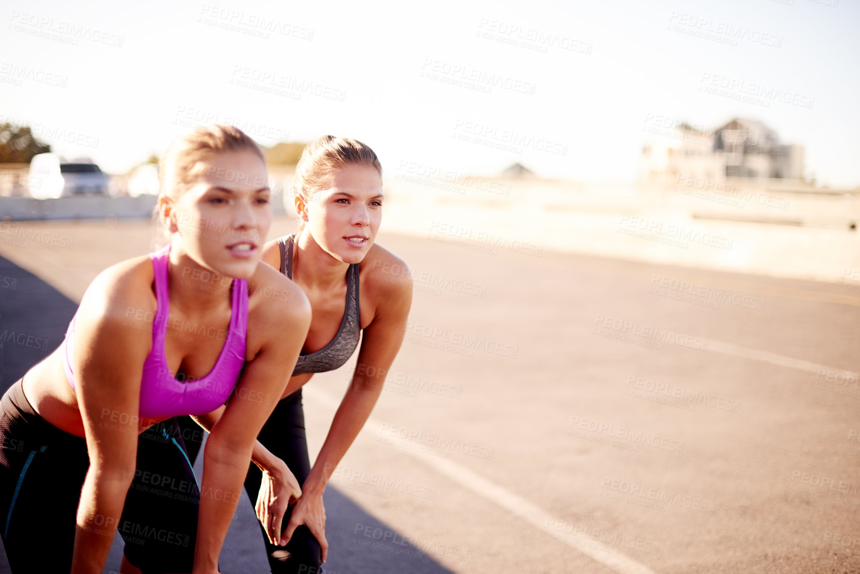 Buy stock photo Tired, friends and fitness for women, exercise and training with sportswear in morning and outdoor. Bridge, athlete and people with routine for wellness, together and healthy with workout in city