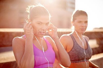 Buy stock photo Bridge, sisters and women with earphones, exercise and training with sportswear in morning and outdoor. Music, athlete and people with routine for wellness, together and healthy with workout in city