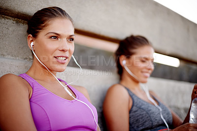 Buy stock photo Music, relax and runner with family in city for fitness podcast, workout and exercise playlist. Health, wellness and earphones with women training outdoors for sports athlete, twin sister or marathon