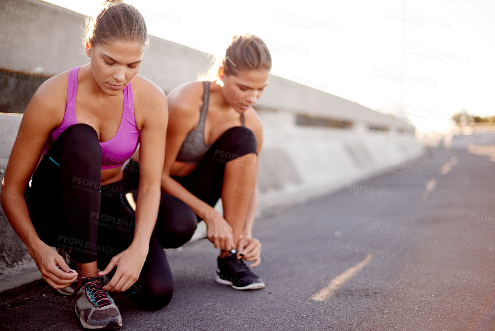 Buy stock photo Women, fitness and tying with shoes in city for workout preparation, exercise or outdoor training. Active, female people or friends getting ready with tie laces for running, cardio or sprint in town