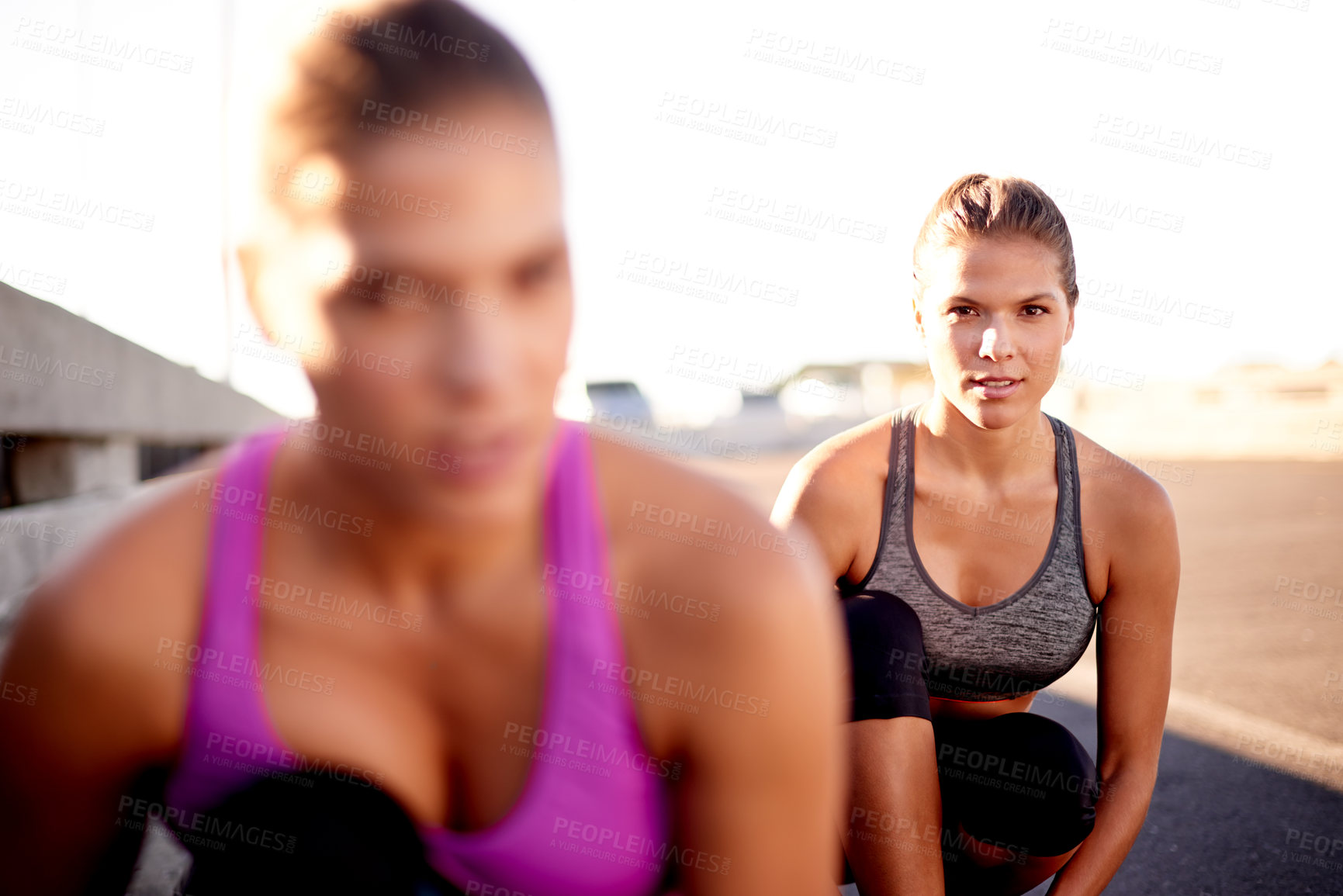 Buy stock photo Women, start and race in city for fitness, ready and competitive on bridge. Friends, portrait and runners in urban Portugal for cardio, training support and outdoor for sports challenge or wellness