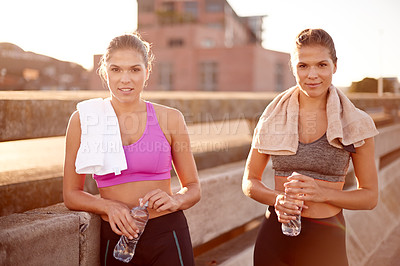 Buy stock photo Fitness, city and women on road with portrait for marathon exercise, cardio workout and training challenge. Athletes, twin sisters and urban run for endurance, water wellness or body goal together