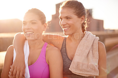 Buy stock photo Fitness, happy sisters and women in city for exercise, training and athlete on workout break at sunset. Sports, twins and outdoor together for body health, wellness and relax with family embrace
