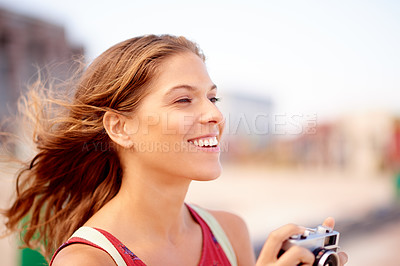Buy stock photo Woman, camera and photography on trip, sightseeing location and tourist to capture view. Wind, travel and student photographer with digital lens, pictures and person on vacation for inspiration