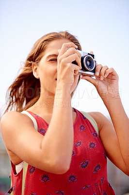 Buy stock photo Woman, camera and travel photography on vacation, sightseeing location and tourist to capture view. Wind, trip and student photographer with lens, pictures and person with equipment for inspiration