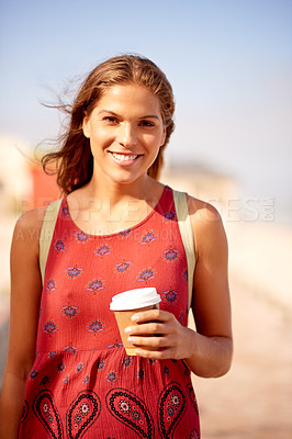 Buy stock photo Outdoor, woman and portrait with coffee for walking, travel destination and espresso for caffeine. Vacation, female person and tourist with happiness for tea cup, adventure and sightseeing at seaside