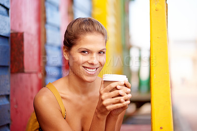 Buy stock photo Smile, happy and portrait of woman with coffee, caffeine beverage and cappuccino by seaside cabin. Travel, beach and person with takeaway latte to relax on holiday, vacation and weekend outdoors