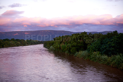 Buy stock photo Forest, lake and water outdoor at sunset for travel, holiday or vacation location with sky. Woods, river and mountain with landscape environment, clouds and ecosystem with trees for tourism in Chile
