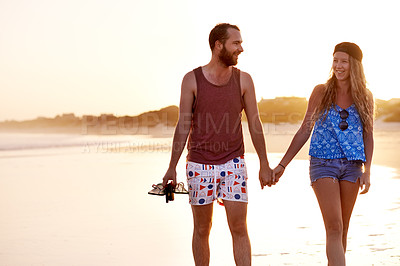 Buy stock photo Couple, happy and holding hands at beach together for travel adventure, vacation and bonding. Space, people and walking by seaside for sightseeing, morning cardio and relationship fun with talking
