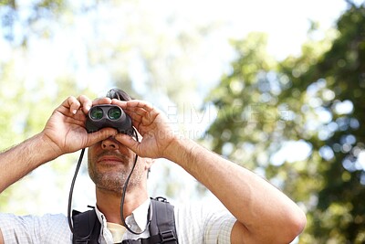 Buy stock photo Man, binoculars and outdoor hiking in woods, tourist adventure and gear for nature discovery. Male person, countryside and glasses for bird watching or sightseeing, location and explore wilderness