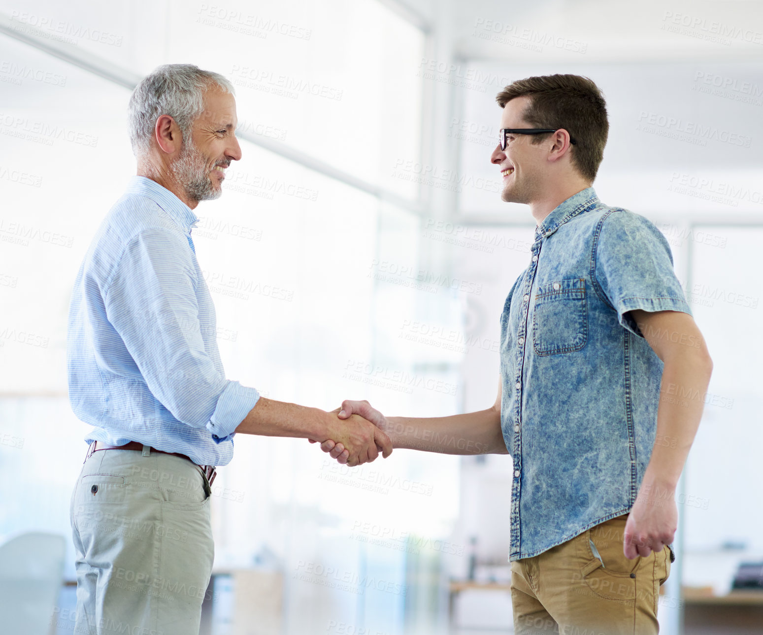 Buy stock photo Happy, businessmen and handshake with interview for hiring, job opportunity or career change at office. Male people, CEO and shaking hands with junior designer or intern for employment or recruitment