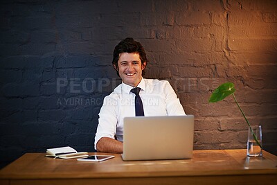 Buy stock photo Businessman, portrait and laptop at desk for reading, online and research for career with pride. Internet, technology and happy male person in office at night with computer for streaming or email   